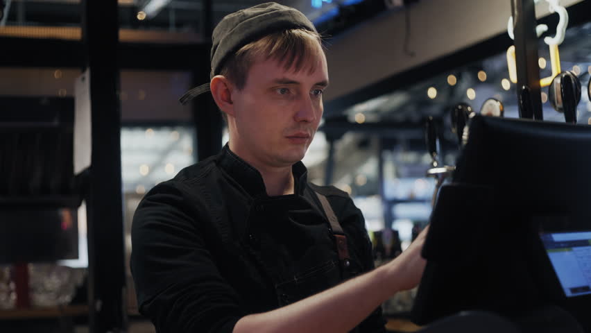 Cashier Using Touch Screen Register