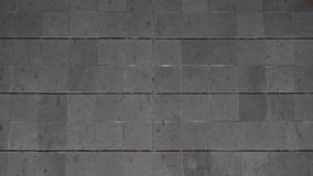 The floor surface is made of dark gray tiles or stones. The tile pattern looks neat with grout lines that form symmetrical squares. - Powered by Shutterstock - Get 15% off with code: PIKWIZARD15