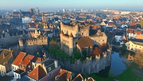 Ghent medieval castle in Belgium, drone shot of historic Ghent city centre at sunrise, Ghent Castle of Counts, Belgian tourist landmark - Powered by Shutterstock - Get 15% off with code: PIKWIZARD15