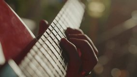 Guitarist's skilled hands navigating red electric guitar's fretboard, capturing intricate finger movements and musical passion during detailed close up performance - Powered by Shutterstock - Get 15% off with code: PIKWIZARD15