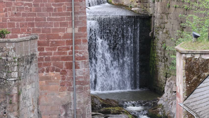 Waterfall with ancient water mills in the city of Saarburg. Germany.