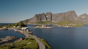 Enchanting coastal scenery showcases picturesque islands framed by majestic mountains under a clear sky. Tranquil waters reflect the stunning natural beauty of Lofoten Norways landscape. - Powered by Shutterstock - Get 15% off with code: PIKWIZARD15
