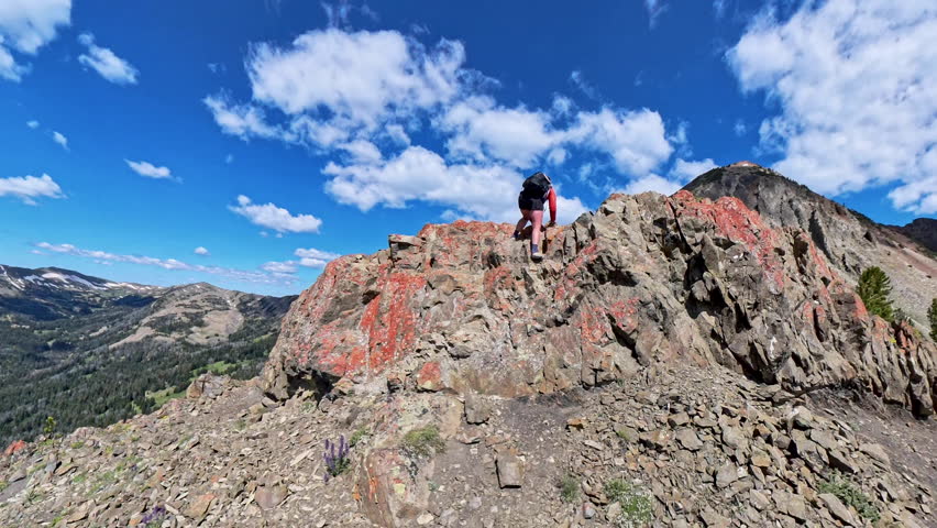 Climbing Down Rocks on Electric Peak Trail in Yellowstone National Park