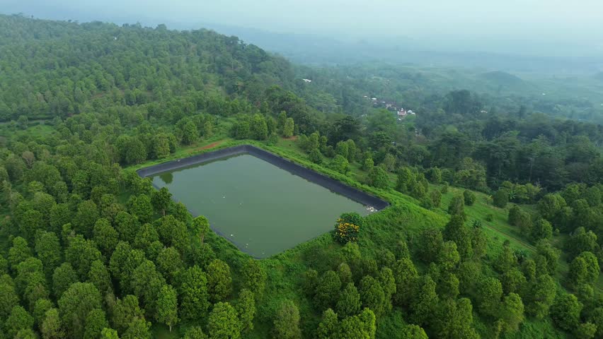 Aerial View of a Highland Water Reservoir in Lush Landscape