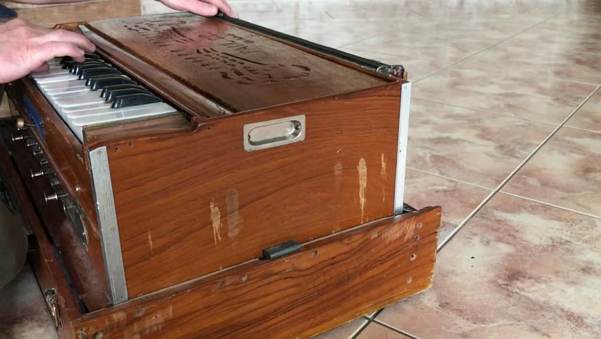 An old harmonica on the tiled floor - Powered by Shutterstock - Get 15% off with code: PIKWIZARD15
