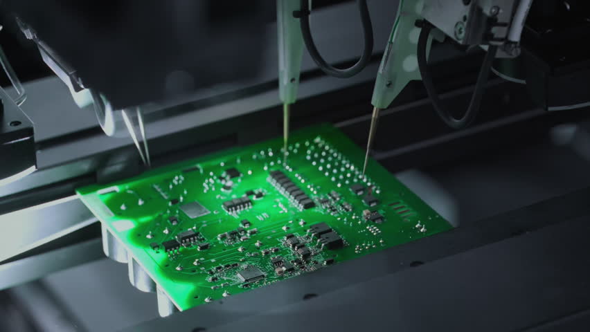 Close-up: installing electronic components. Printed circuit board moves with SMD. Automatic welding, solder machine. Production technology. Diagnose test chips and processors. Manufacture of High-tech
