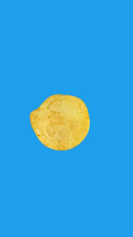 Looped animation of a single potato chip rotating 360 degrees on a blue chroma key background. Ideal for food ads, product promos, and motion graphics projects.