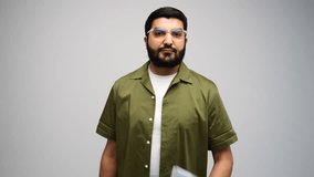 Young Man Engaged With Laptop in a Minimalist Studio, Showcasing Focus and Determination While Working Creatively - Powered by Shutterstock - Get 15% off with code: PIKWIZARD15