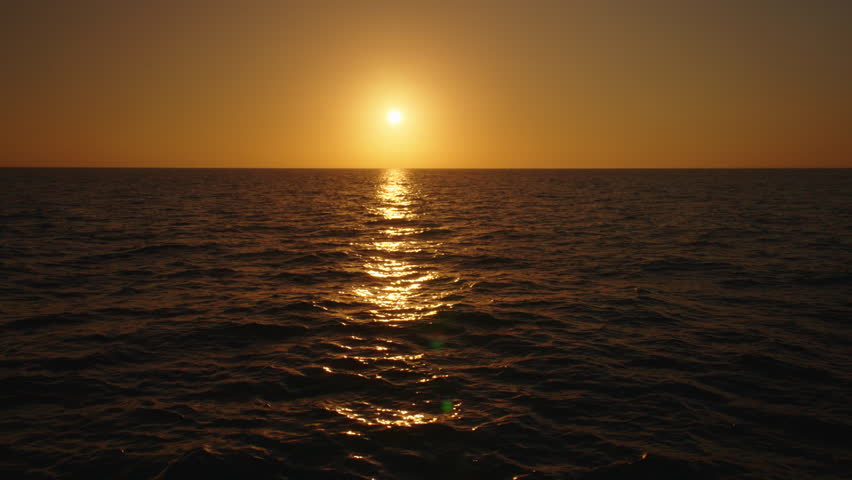 Immerse yourself in the serene and breathtaking beauty of a sunset. Watch as the ocean waves elegantly dance while the day gradually transitions into the peaceful and calm embrace of night