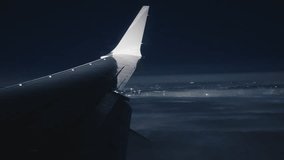 The captivating view from an airplane window at night while landing is mesmerizing with vibrant city lights sparkling below, creating a magical sight - Powered by Shutterstock - Get 15% off with code: PIKWIZARD15