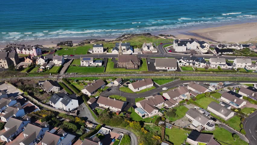 Aerial video of Christ Church of Ireland Castlerock Village on the Atlantic Ocean Coleraine Co Derry Northern Ireland 