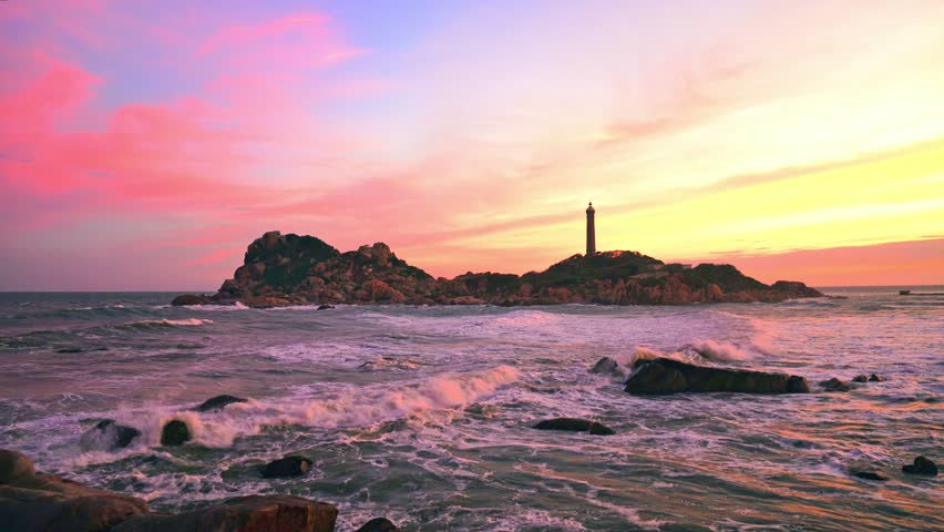 Beautiful Sunset Ke Ga Lighthouse with surf patted smoother reefs create clouds on sea as this is only ancient lighthouse is located on island in Vietnam