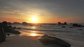 Beautiful sunrise dawn beach with waves, sand, sunrise sky gradually rising to the horizon. Seascape to relax the soul - Powered by Shutterstock - Get 15% off with code: PIKWIZARD15