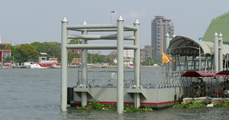 A modern docking station a river surrounded by urban beauty capturing tranquility.