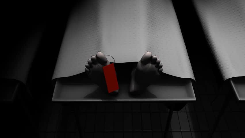 A still scene inside a morgue or mortuary with a dead body in a corpse room. The somber, clinical setting conveys the seriousness and respect surrounding post-mortem procedures.