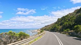 A serene drive along the Great Ocean Road with ocean views and lush greenery under clear blue skies - Powered by Shutterstock - Get 15% off with code: PIKWIZARD15
