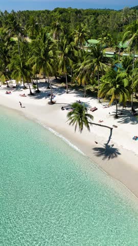 Enjoy a peaceful day on the soft sandy shores of a beautiful Thai beach. Lush palm trees sway gently in the warm breeze at Koh Kood Island Thailand
