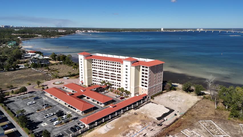 Aerial view of a colorful red hotel building in Panama City Beach in Florida