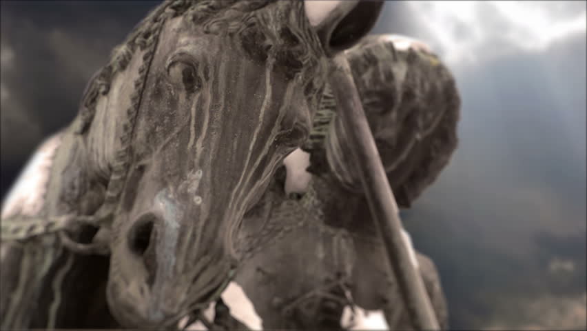 Statue of Saint Michael with surreal sky 