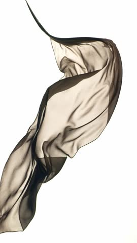 Pastel color transparent silk fabric flowing by wind, super slow motion. Fiilmed on high speed cinematic camera at 1000 fps.