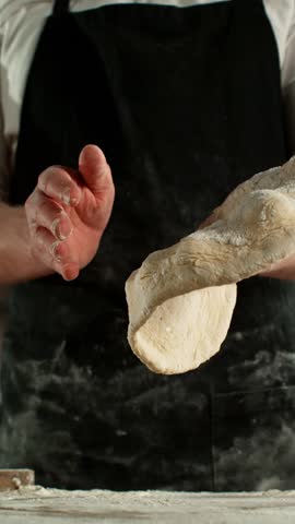 Super Slow Motion of Chef Making Yeast Dough . Filmed on High Speed Cinema Camera, 1000 fps . Closeup of Bread or Pizza Dough Preparation