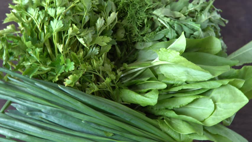 Green onions, spinach, parsley and dill. Vitamin food. Prepare greens for salad. Set different leaves