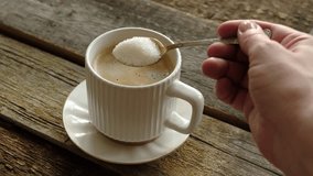 Woman drinking coffee. Hand stirring sugar in a mug of espresso coffee. Morning routine, energy boost. - Powered by Shutterstock - Get 15% off with code: PIKWIZARD15
