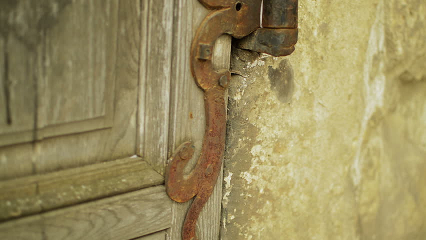 Architectural detail of old medieval style  hinge on wood door | Shutterstock HD Video #3775742