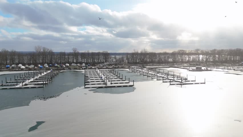 Aerial shot of a dock in the winter in Erie, PA.