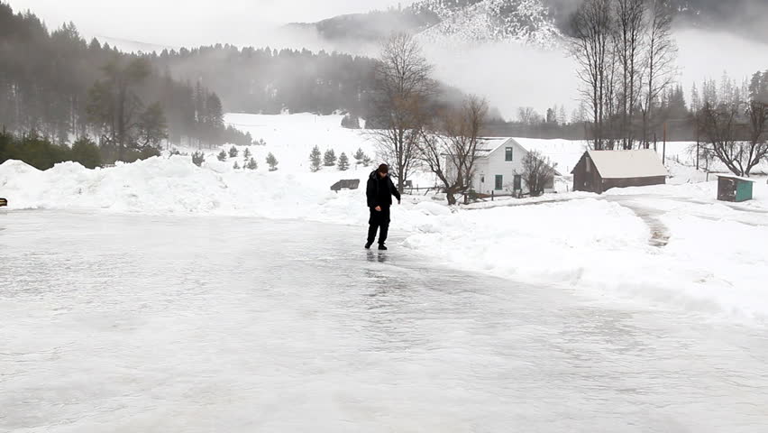 Man slipping on ice on a ranch in Montana