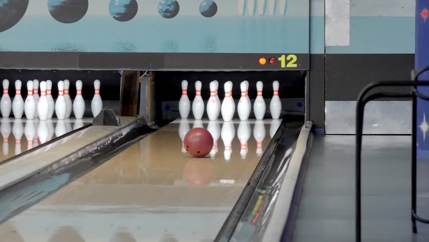 An exhilarating bowling experience with dynamic strikes and spares unfolds at a vibrant, modern alley