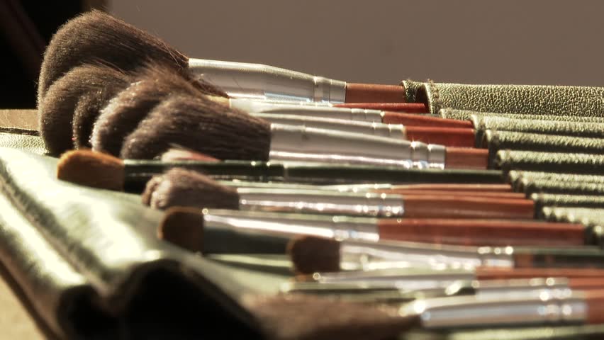 This  video displays a variety of makeup brushes, highlighting their soft bristles and different colors. Ideal for beauty, cosmetics, and makeup product promotions.