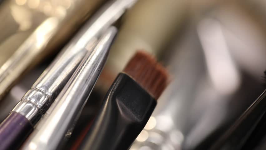 This  video displays a variety of makeup brushes, highlighting their soft bristles and different colors. Ideal for beauty, cosmetics, and makeup product promotions.
