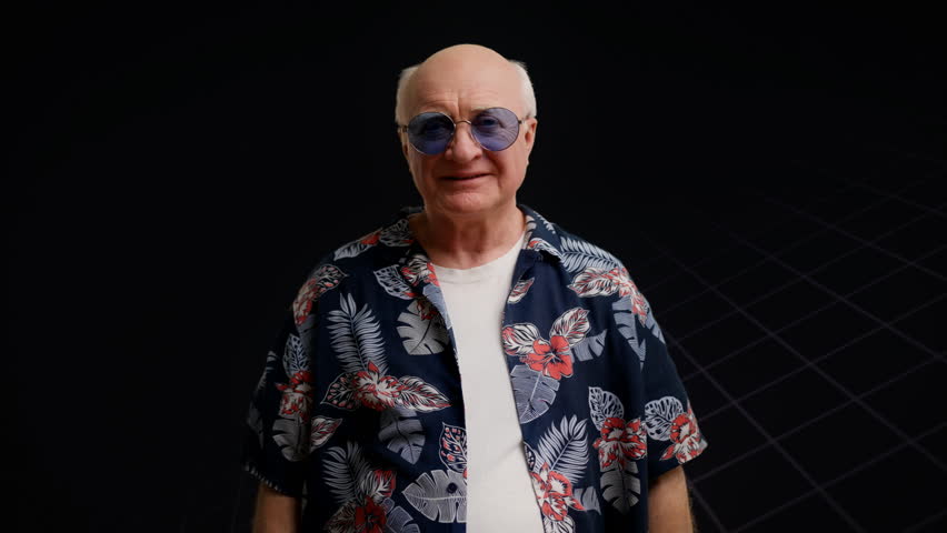 Trendy grandpa in sunglasses folding arms and smiling on futuristic superstar bg