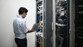 Computer engineer is setting up network in server room,Systems Maintenance Technician,Male engineer working in server room at modern data center	
 - Powered by Shutterstock - Get 15% off with code: PIKWIZARD15