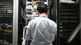 Computer engineer is setting up network in server room,Systems Maintenance Technician,Male engineer working in server room at modern data center	
 - Powered by Shutterstock - Get 15% off with code: PIKWIZARD15
