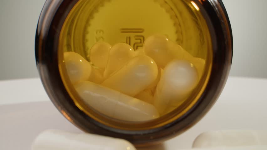 Pills and vitamins macro, Close up view of womans hands holding plenty of different drugs. Painkillers and antibiotics. Healthcare and medicine concept
