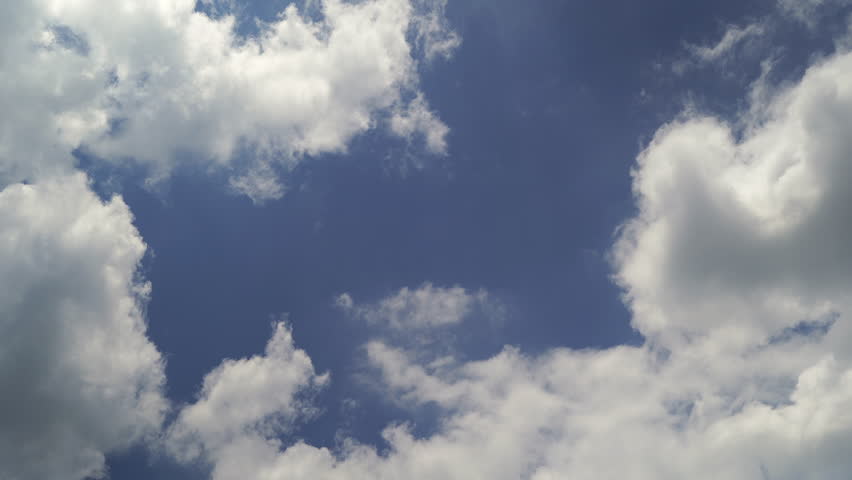Time lapse of clouds moving on a clear blue sky day.