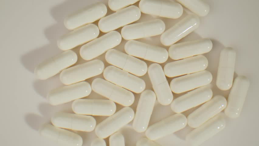 Pills and vitamins macro, Close up view of womans hands holding plenty of different drugs. Painkillers and antibiotics. Healthcare and medicine concept