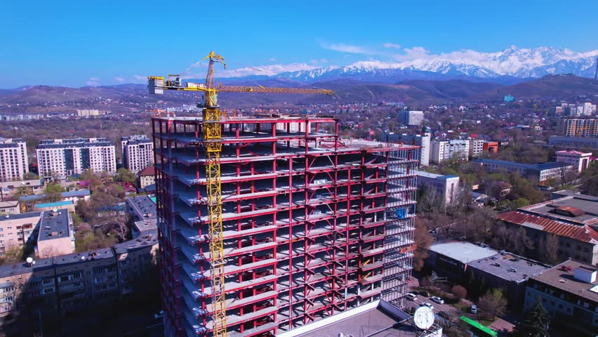 High-Rise Construction with Tower Crane in City Center