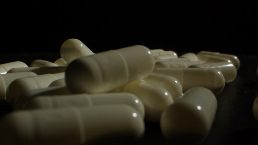 Pills and vitamins macro, Close up view of womans hands holding plenty of different drugs. Painkillers and antibiotics. Healthcare and medicine concept