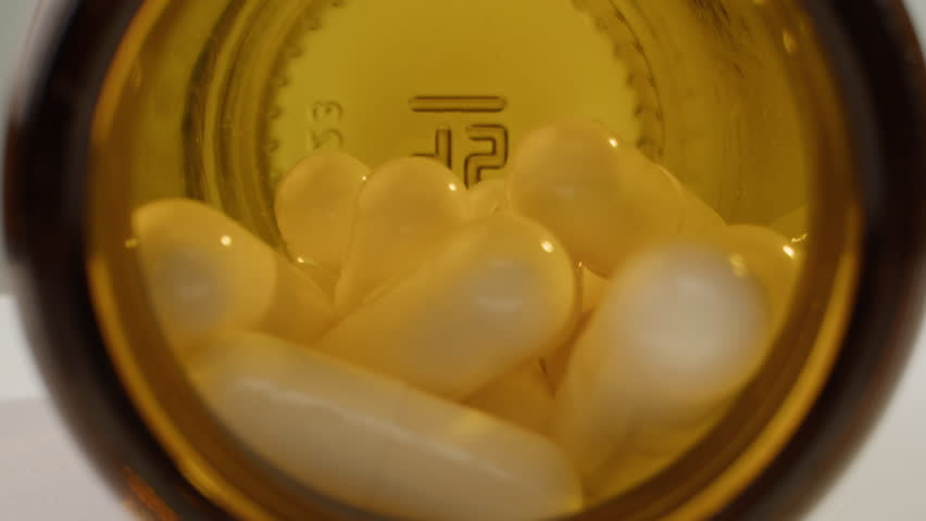 Pills and vitamins macro, Close up view of womans hands holding plenty of different drugs. Painkillers and antibiotics. Healthcare and medicine concept