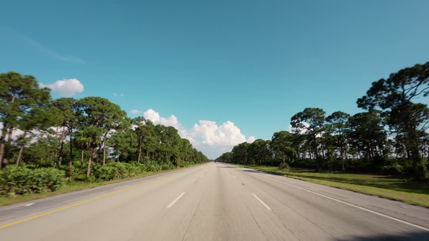 POV view from driving car On a rural road 