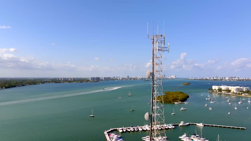 Communications tower Miami North Bay Village. Aerial stock video drone orbit 4k