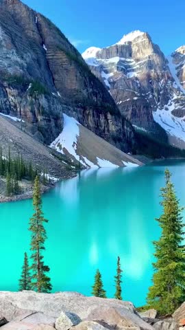 Scenic View of Moraine Lake and Snow-Capped Peaks in Banff National Park, Canada