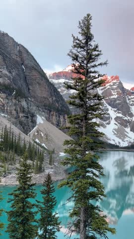 Golden Sunrise Over Moraine Lake and Rocky Mountains in Banff National Park