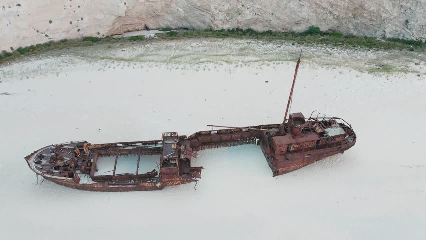 Abandoned Ship on the Shores of Iceland, Surrounded by the Vast Ocean and Rugged Seaside Landscape