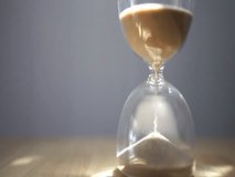 An elegant hourglass capturing the passage of time in soft morning light. 
 - Powered by Shutterstock - Get 15% off with code: PIKWIZARD15