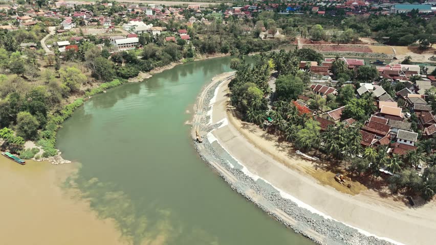 From an aerial view, the city of Rome, Italy, reveals its ancient buildings and urban landscape under the vast European sky