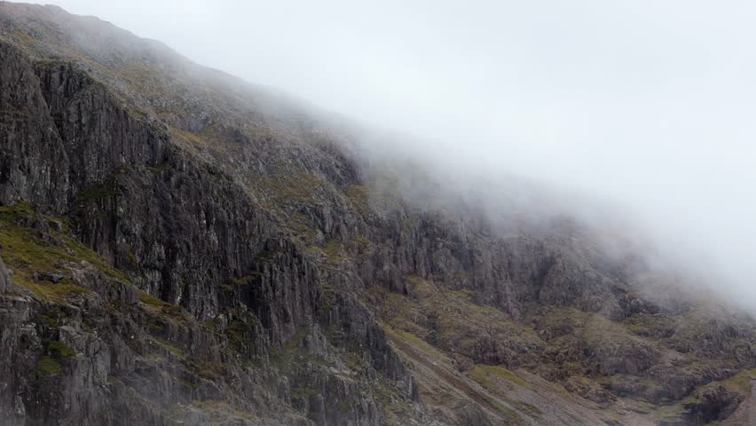 Aerial drone footage of the Glencoe mountain face in the Scottish Highlands,